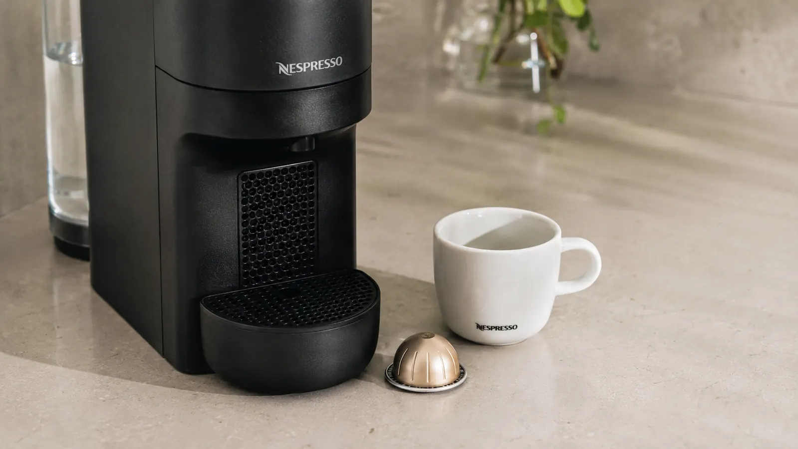 Row of different Nespresso Original Line capsules arranged by intensity from light to dark roast